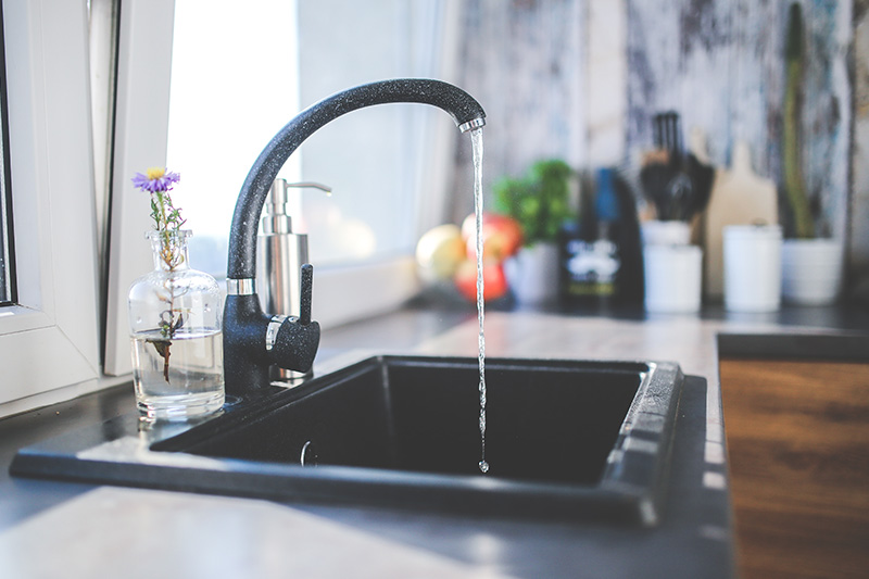 photo of black kitchen faucet and sink
